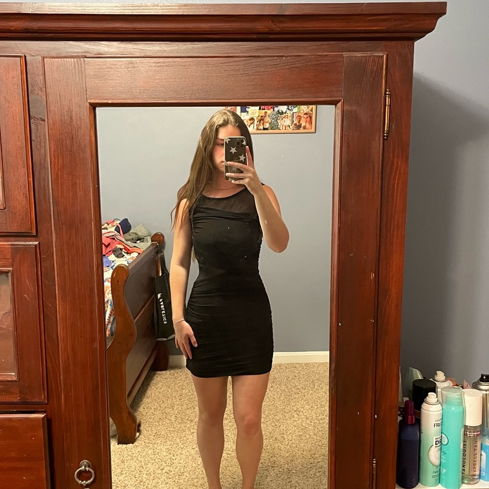 Tight black ruffled dress with mesh detail